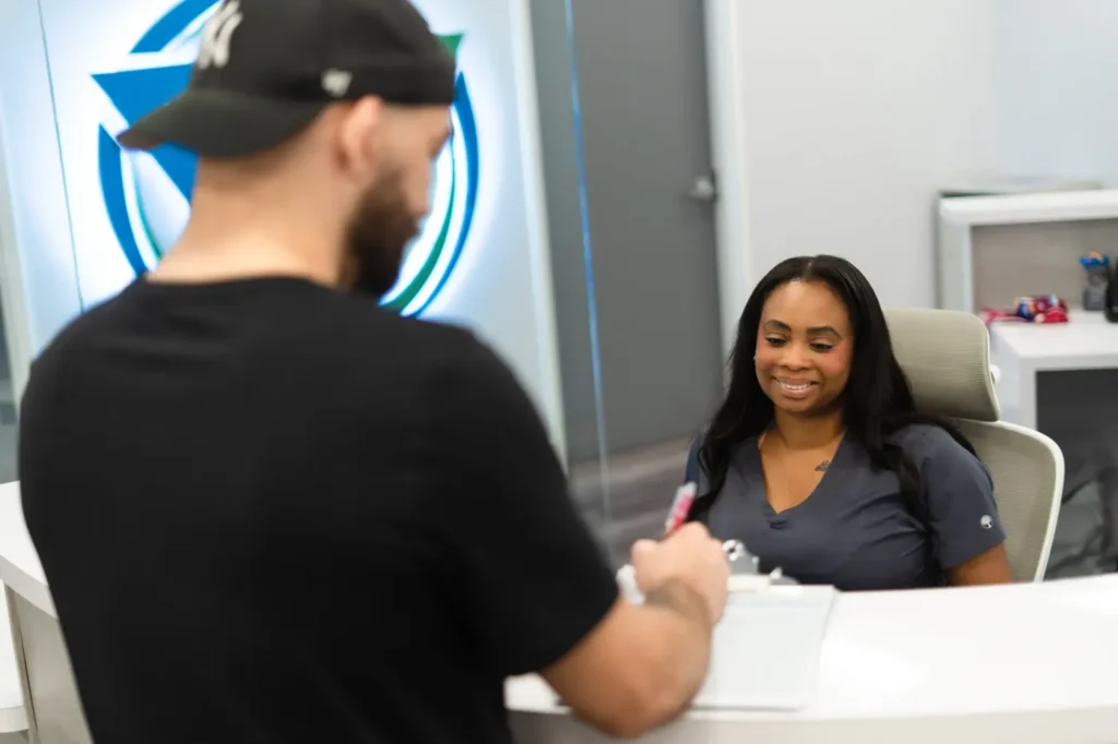 Patient checking in at the FTG Ortho front desk for an appointment