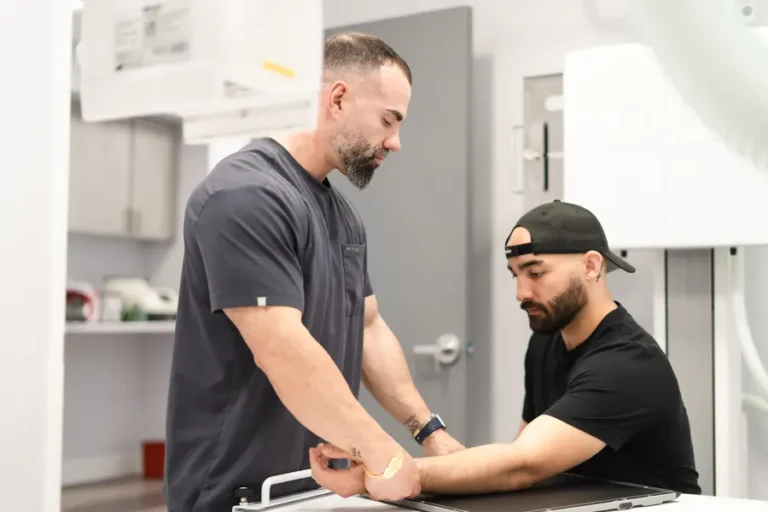 FTG Ortho technician positioning a patient's arm for an on-site digital X-ray